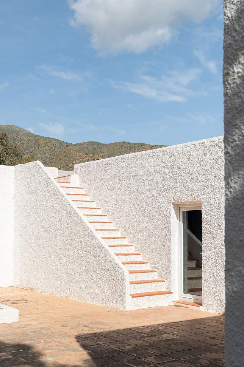 White exterior stairs against a blue sky