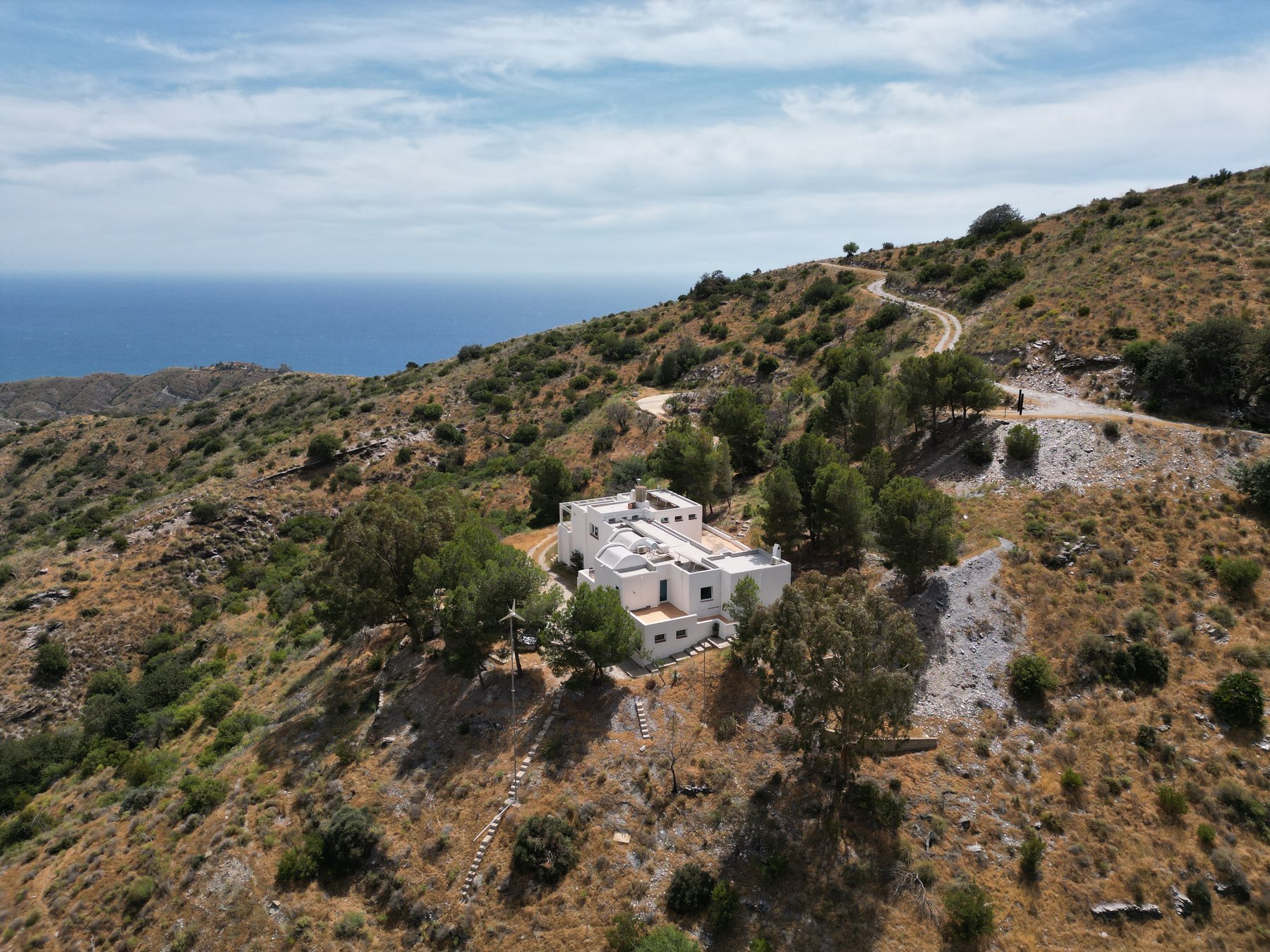 The house alone on the hillside above the sea